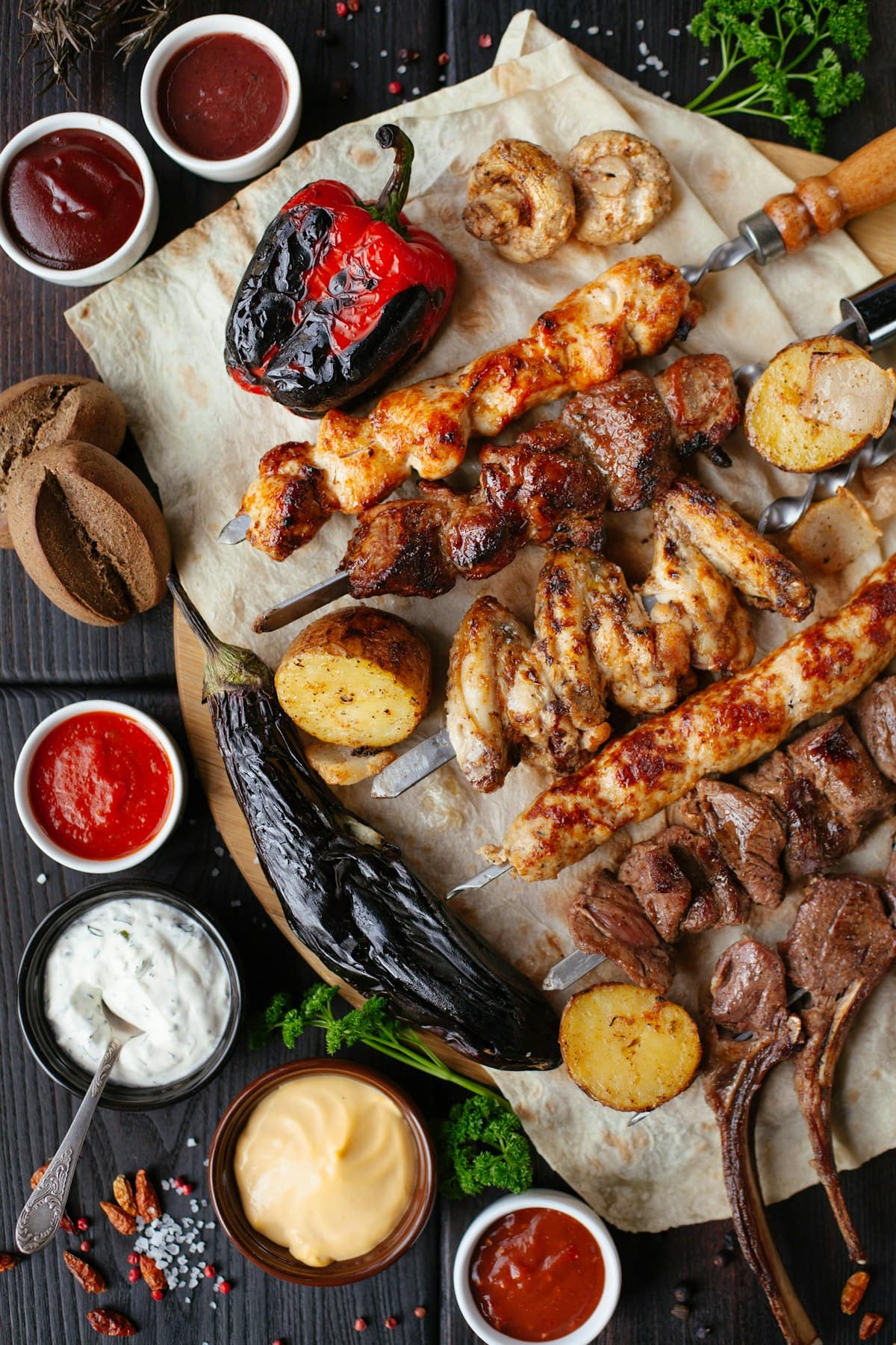 Sizzling Japanese chicken yakitori skewers grilled over hot coals brushed with glistening dark tare sauce and interspersed with charred green scallions
