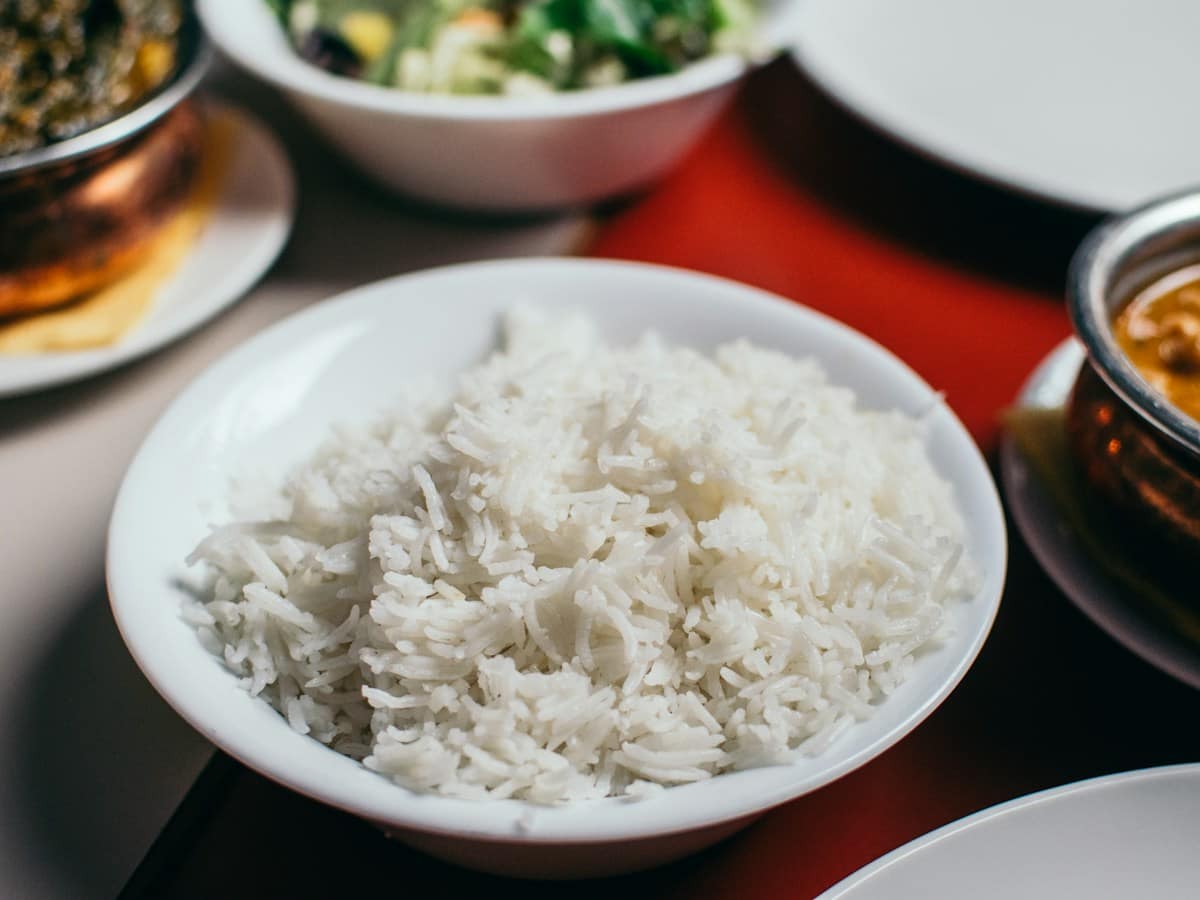 10-Minute One-Pot Garlic Butter Jasmine Rice and Sweet Corn Skillet in a cast iron pan